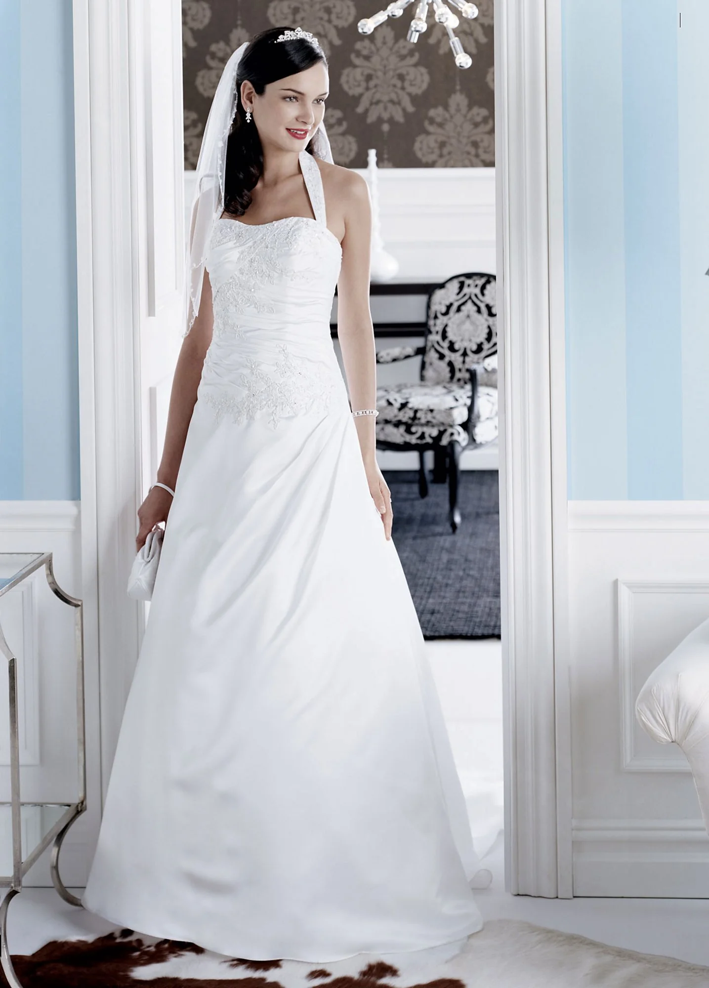 Satin A-line gown with beaded metallic lace applique.